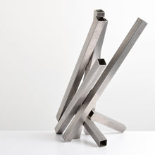 Load image into Gallery viewer, Tony Rosenthal (1914-2009), N.A., Crocus, 1979, Sculpture of Welded Stainless Steel, 33.5 x 24 x 20 inches, This sculpture is composed of seven square-shaped hollow beams, welded together in diagonal orientations. Rosenthal's work is collected by major museums, including Museum of Modern Art (MoMA). Tony Rosenthal Sculpture