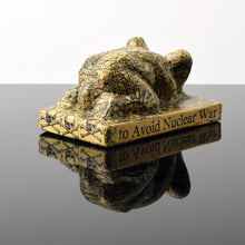 Load image into Gallery viewer, Front:Tom Otterness (b.1952-) We Should Work with the Soviets to Avoid Nuclear War, 1982 Papier Mache over Cast Plaster 3.25h x 6w x 3.5d inches Otterness is described as “the world’s best public sculptor” by New York Times art critic, Ken Johnson, Otterness' works are easily recognizable for its unique, cheerful and cartoonish figures, that are used to address issues of gender, class and race. Available at Manolis Projects Gallery