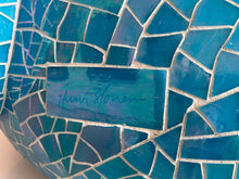 Load image into Gallery viewer, Close up of Hunt Slonem&#39;s signature and glass mosaic tiles on Hunt Slonem’s Blue, glass mosaic, bunny sculpture, Argo. Standing at 122 inches tall and 43 inches wide, it is for sale at Manolis Projects Art Gallery in Miami, FL
