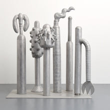 Load image into Gallery viewer, Carol K. Brown (b. 1945 - ) Untitled Sculpture: Six Vertical Elements., 1986 Aluminum Sculpture 53h x 48w x 30d inches Carol K. Brown is a visual artist based in Miami and New York. She began her career as a sculptor, but her work has evolved through numerous phases: anthropomorphic abstractions, figurative paintings, and social commentary. This aluminum statue is composed of six separate pieces on an aluminum base. Available at Manolis Projects Gallery.
