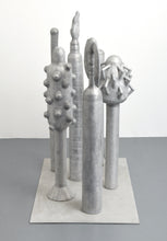 Load image into Gallery viewer, Side View:Carol K. Brown (b. 1945 - ) Untitled Sculpture: Six Vertical Elements., 1986 Aluminum Sculpture 53h x 48w x 30d inches Carol K. Brown is a visual artist based in Miami and New York. She began her career as a sculptor, but her work has evolved through numerous phases: anthropomorphic abstractions, figurative paintings, and social commentary. This aluminum statue is composed of six separate pieces on an aluminum base. Available at Manolis Projects Gallery.

