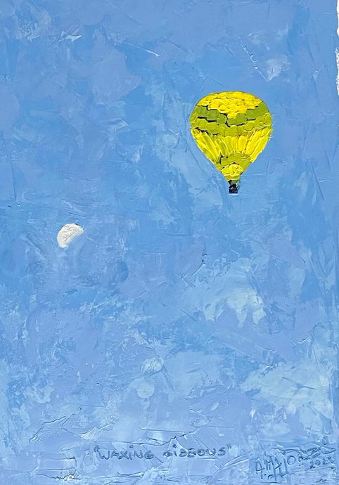 Argentinian artist Aurelia Majorel’s blue and yellow hot air balloon painting “Waxing Gibbous,” 2022, Oil on paper, 16 x 12 inches, on display and available at the Ritz Carlton Miami Beach